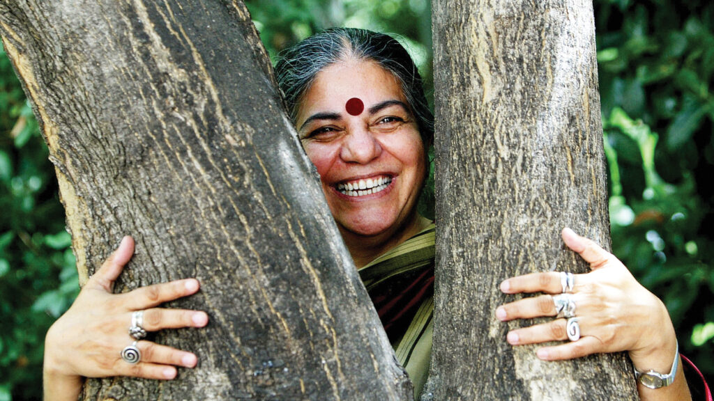 Indian activist Vandana Shiva hugs a tre